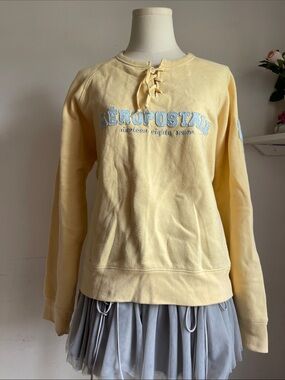 Aeropostale Lace-Up Crewneck Sweatshirt in Pale Yellow with Light Blue Logo
